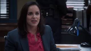 Melissa Fumero puts her sock and boot on
