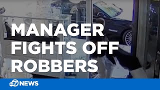 Jewelry store manager fights off would-be robbers armed with sledgehammers