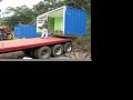 Loading with a crane, 2 20ft shipping container homes in Costa Rica