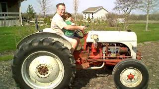 Grandpa, Grant, And Wili On The Tractor