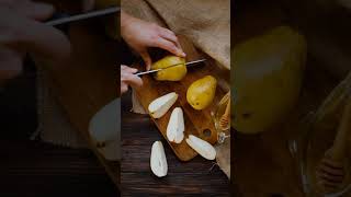 A Person Slicing A Pear Using A Knife By Ss Fruit Cutting
