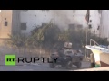 Rain of Molotovs: Bahraini protesters batter police armored vehicles with petrol bombs