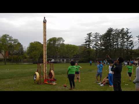 Student tries to ring the bell on our High Striker/strength tester at University of Iowa