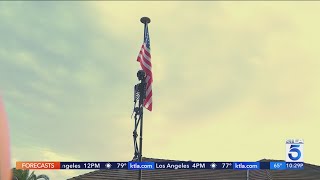 Skeleton Decoration Hanging From American Flag Raises Concerns