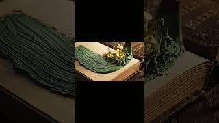 A Paintbrush Creates A Glowing Forest On A Book Magic Scene