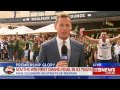 Rabbitohs fan flashes during Channel Nine News live cross