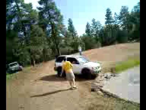 Isuzu Rodeo Sport stuck in mud in flagstaff and sum old timer pulled us out