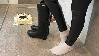 Girl crushes cake with hunter boots. Wellie food crushing. Wam. Rubber boots tra