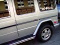 2002 GOLD 140-INCH MERCEDES CUSTOM 14 PASSENGER G500 LIMOUSINE BY AMERICAN LIMOUSINE SALES