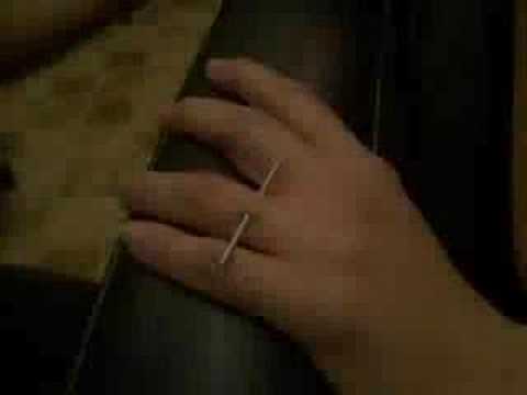 Girl gets a surface piercing on her finger. Girl gets a surface piercing on her finger.