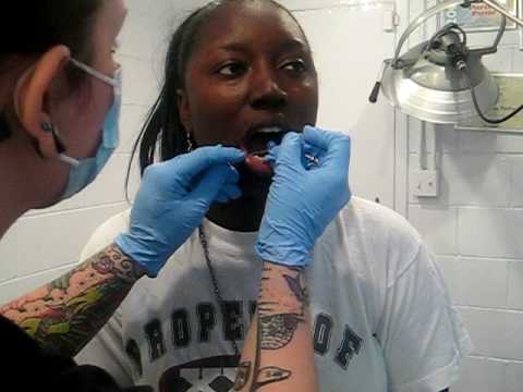 Yanna gets lower lip pierced