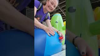Deflating A Beach Ball. Second-Hand Shop With Inflatable Toys.