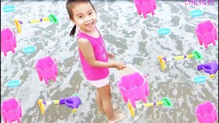 Kids Playing On The Beach Play Sand Toys With Lynlyn.