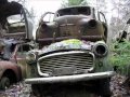 Abandoned cars in forgotten junkyard (Båstnäs) in sweden