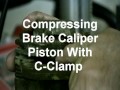 Compressing Brake Caliper Piston With C-Clamp