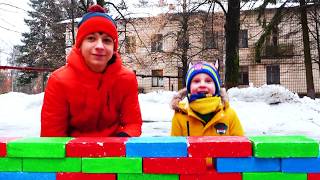 Max and Nikita playing with cars