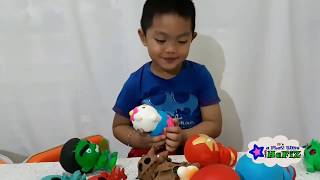 unboxing and playing squishy action figures captain America, hulk, iron man and spiderman
