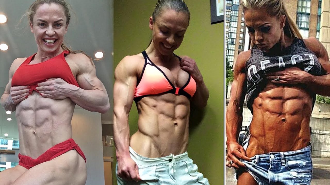 Ripped female bodybuilder topless workout
