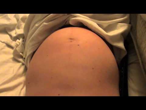 Camgirl pregnant belly movements