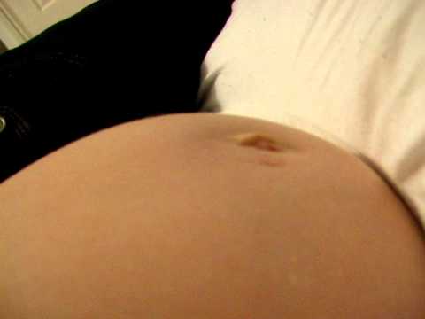 Camgirl pregnant belly movements