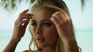 Blonde Girl With Mesmerizing Blue Eyes By The Sea