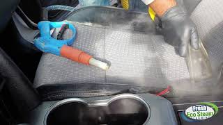 Deep cleaning seats with steam to remove the hidden stains.