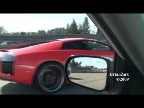 Brian spots a sick red Lamborghini Murcielago Coupe with black wheels 