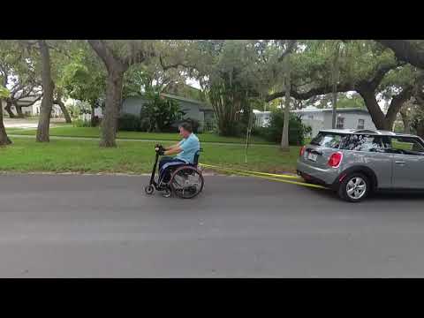Wheelchair towing a car! Must see!