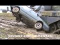 Tank runs over a VW Passat estate