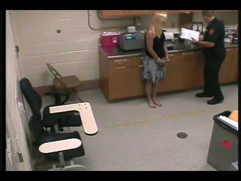 She fails and is arrested and handcuffed behind She fails and is arrested and handcuffed behind