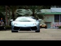 Light Blue Lamborghini Aventador LP700-4 Roadster driving at Miami Beach Florida