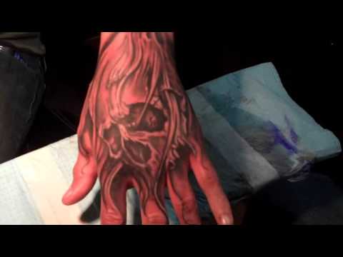 skull hand tattoo by jason dunn