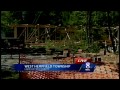 Crews rebuild covered bridge washed away by floodwaters