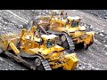 Caterpillar D11R CD's Stripping Blasted Rock