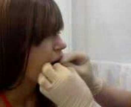 Marilyn at the professional beauty excel show 2007 getting her lip pierced Marilyn at the professional beauty excel show 2007 getting her lip pierced