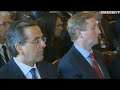 Enda Kenny checks his phone during Pope Benedict speech
