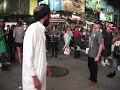 MUSLIM MAN GETTING READY TO FIGHT IN TIME SQUARE N.Y