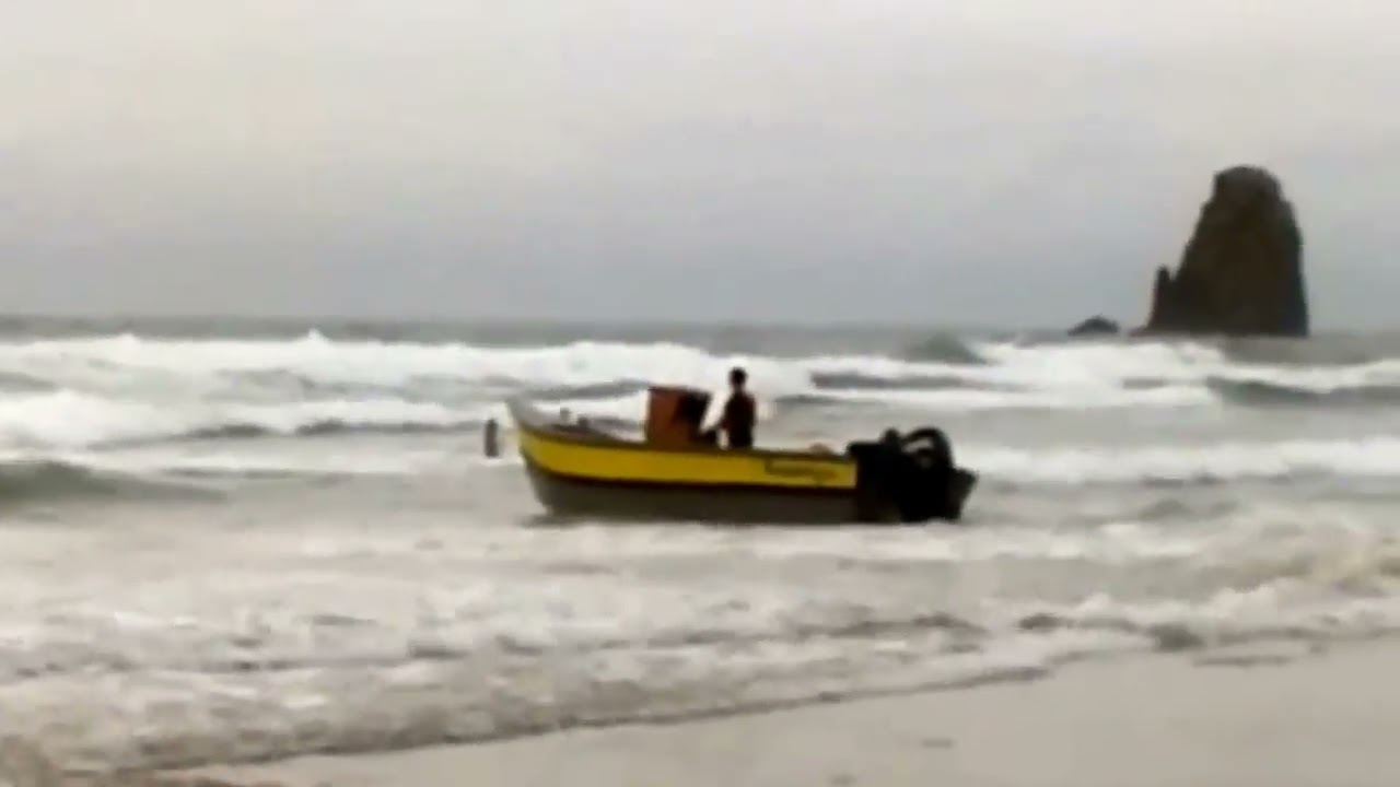 Launching a Pacific Dory in the Surf - YouTube