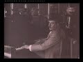 Giacomo Puccini playing piano