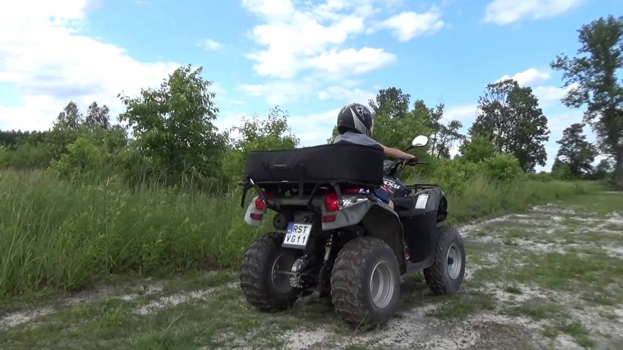 Kid learns ride on the ATV quad