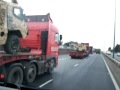 Vector military vehicles on a convoy of 3 low loaders