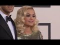 Grammy Awards: Rita Ora and Calvin Harris loved up on the red carpet in LA