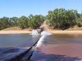 Road Train going flat-out over a river crossing - Western Australia