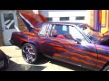 Purple/Orange "Double trouble" Cutlass with LS6 engine & sitting on 24's @ Choices car club car show