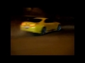 Toyota Supra drifting around a roundabout infront of cops.