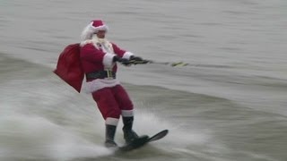 Watch Santa water-ski with reindeer