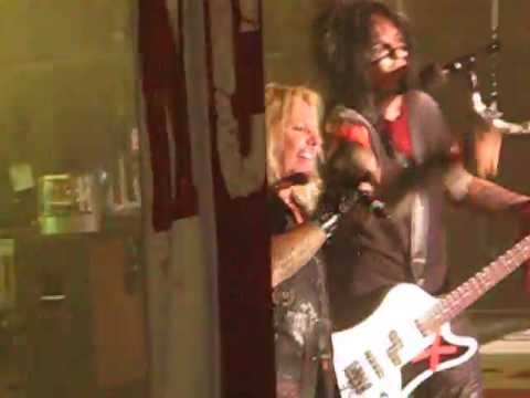 chick swinging on chains - Primal Scream