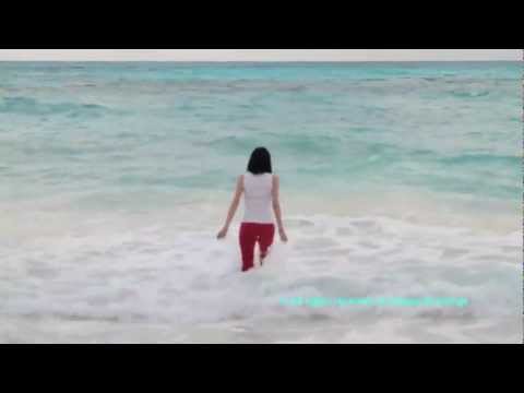 Vacation - swimming in Cancun in red pants and white top