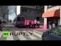 Riot police painted pink during clashes with anti-government protesters in Italy