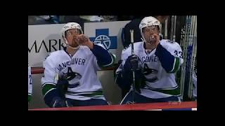The Sedin Twins Having A Drink At The Bench